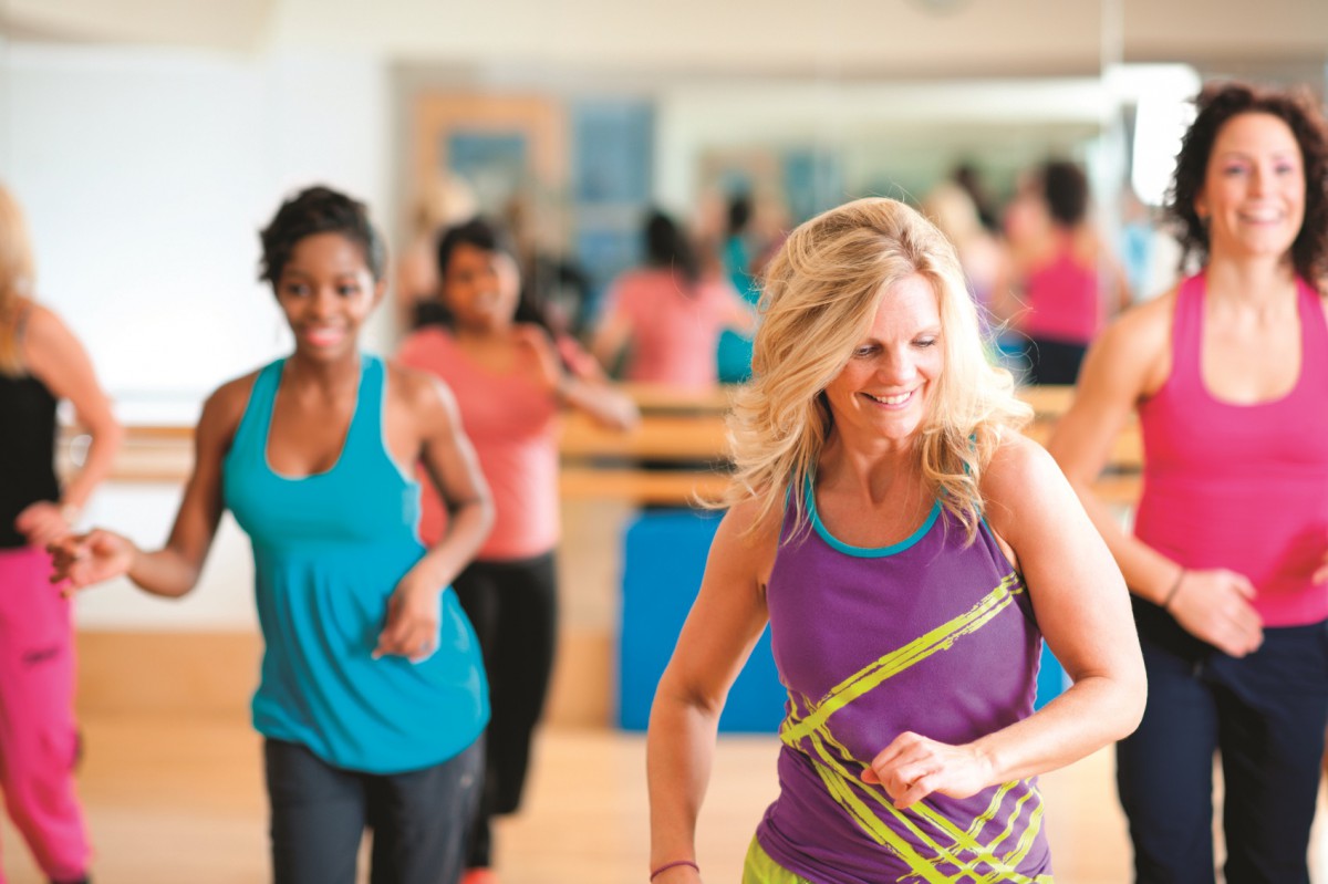A dance fitness group working out at the gym